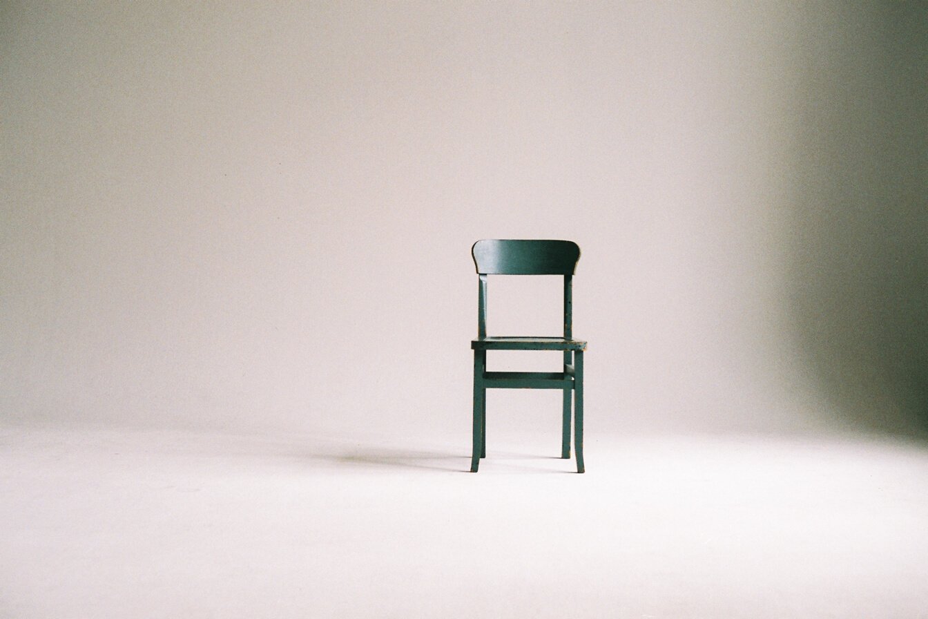 Wooden Chair on a White Wall Studio 